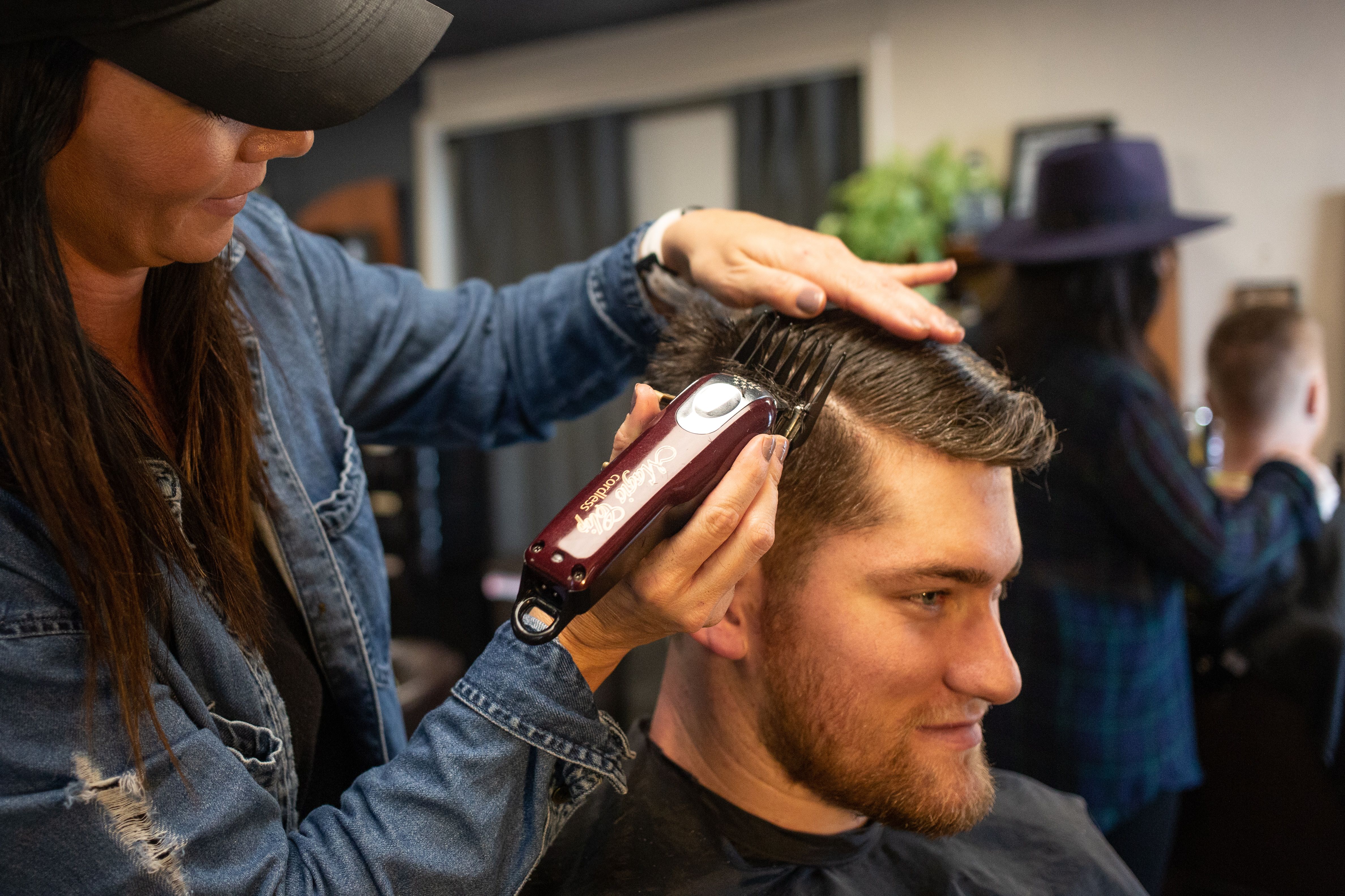 Professional getting haircut before headshot session